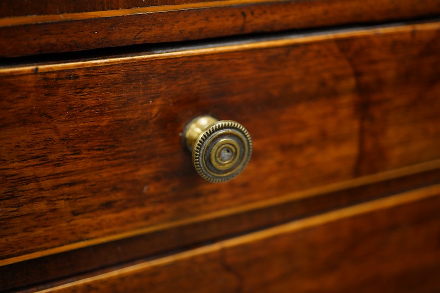 A George III mahogany miniature four drawer chest and key, 40cm high, 35.5cm wide. Condition - good